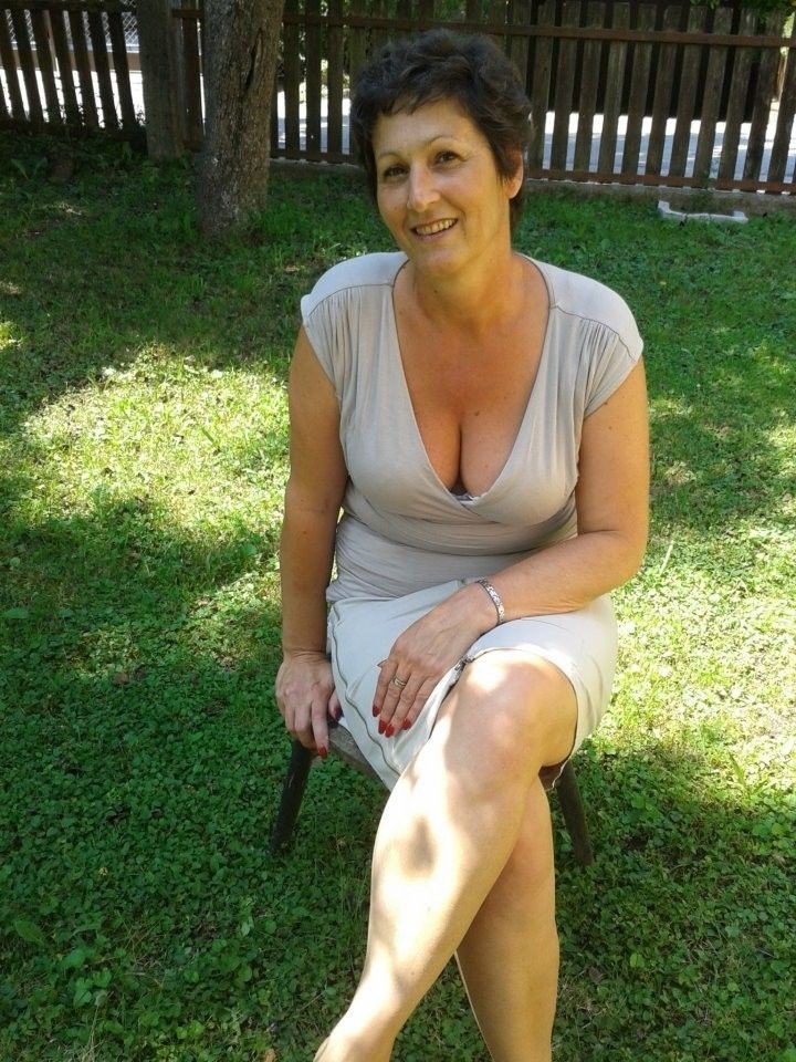 Mature milf in the window